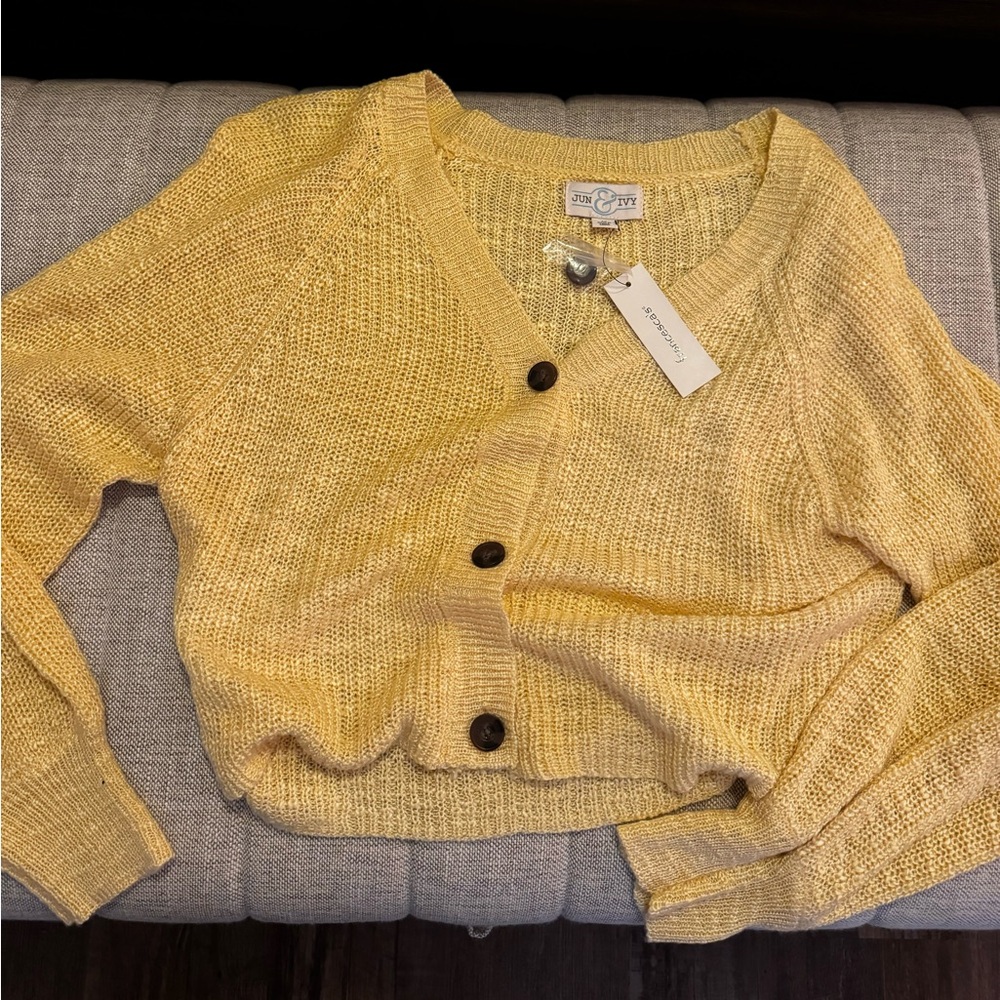 Yellow cardigan.